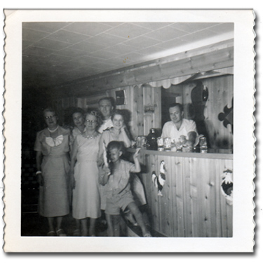 Black and White photo of the finished basement in 1959 with relatives
