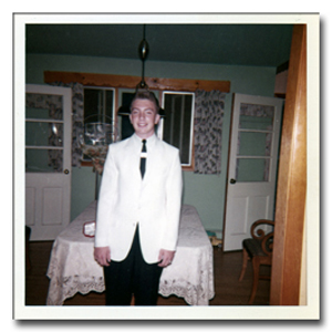 Paul Lachance standing in the dining room at home on Graduation day 1962