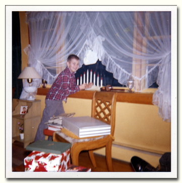 Larry Lachance standing in the window at Christmans in 1962